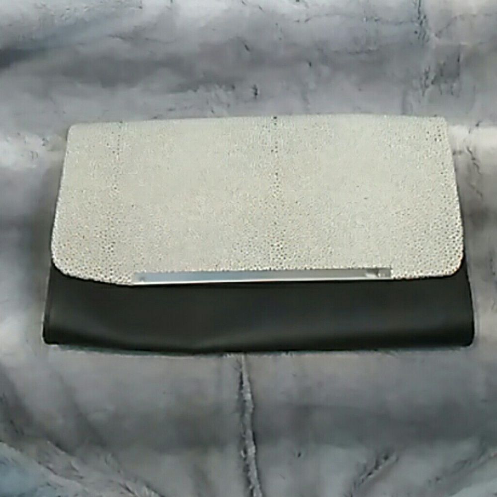 White and black polka dot dalmation print clutch